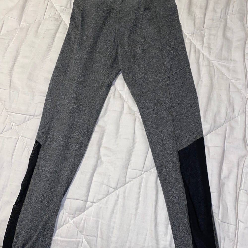 grey leggings with black mesh on lower legs